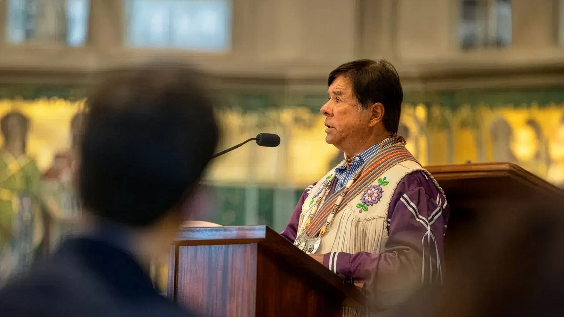 Ray Halbritter at a podium