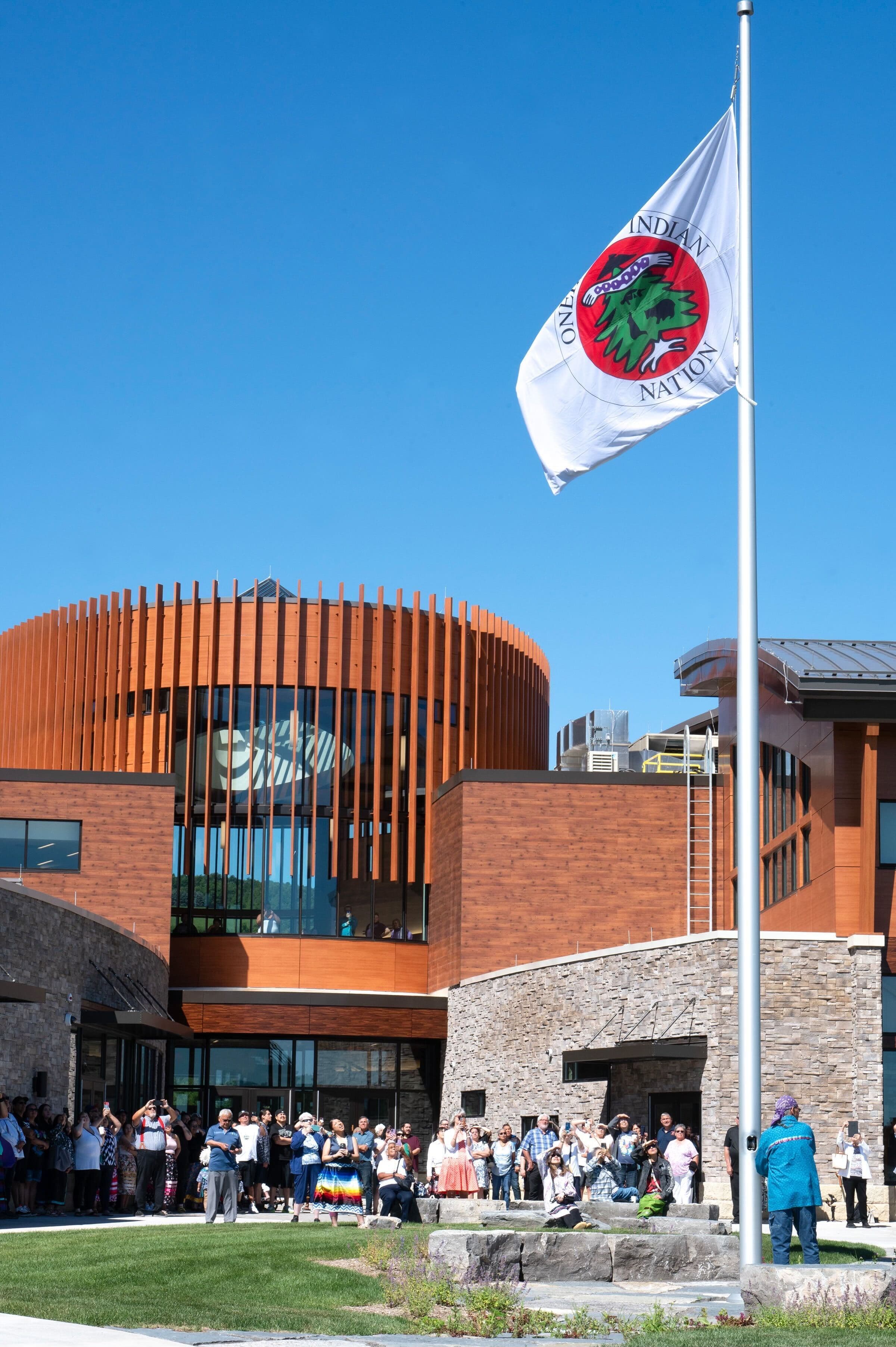 Nation members at center with flag